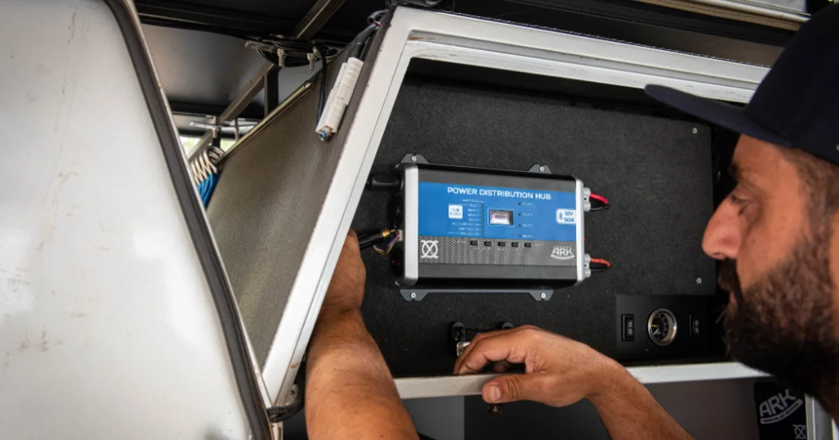 Man installing a 12V power box